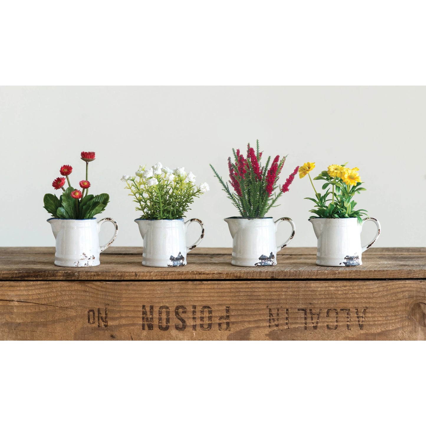 Faux Flowers In Ceramic Pitcher