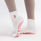 Pink Gummy Bear on Ruffled Cream Pilates Grip Sock